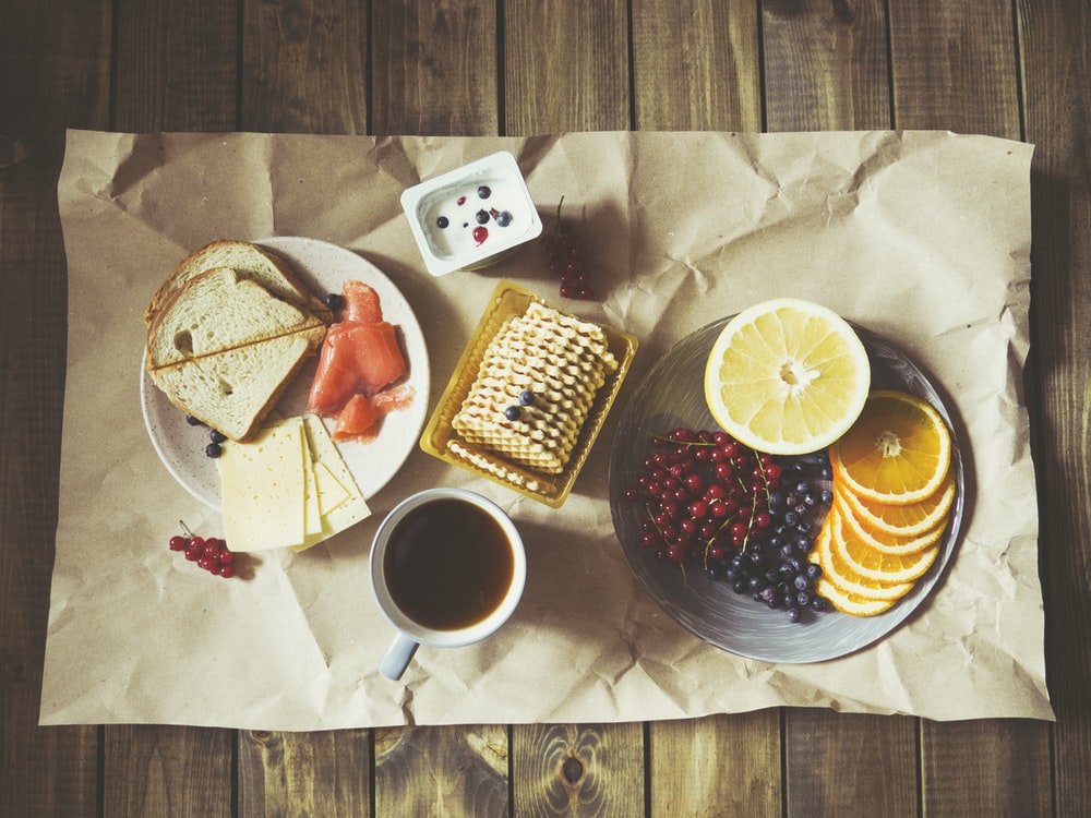 bread and fruits on plate